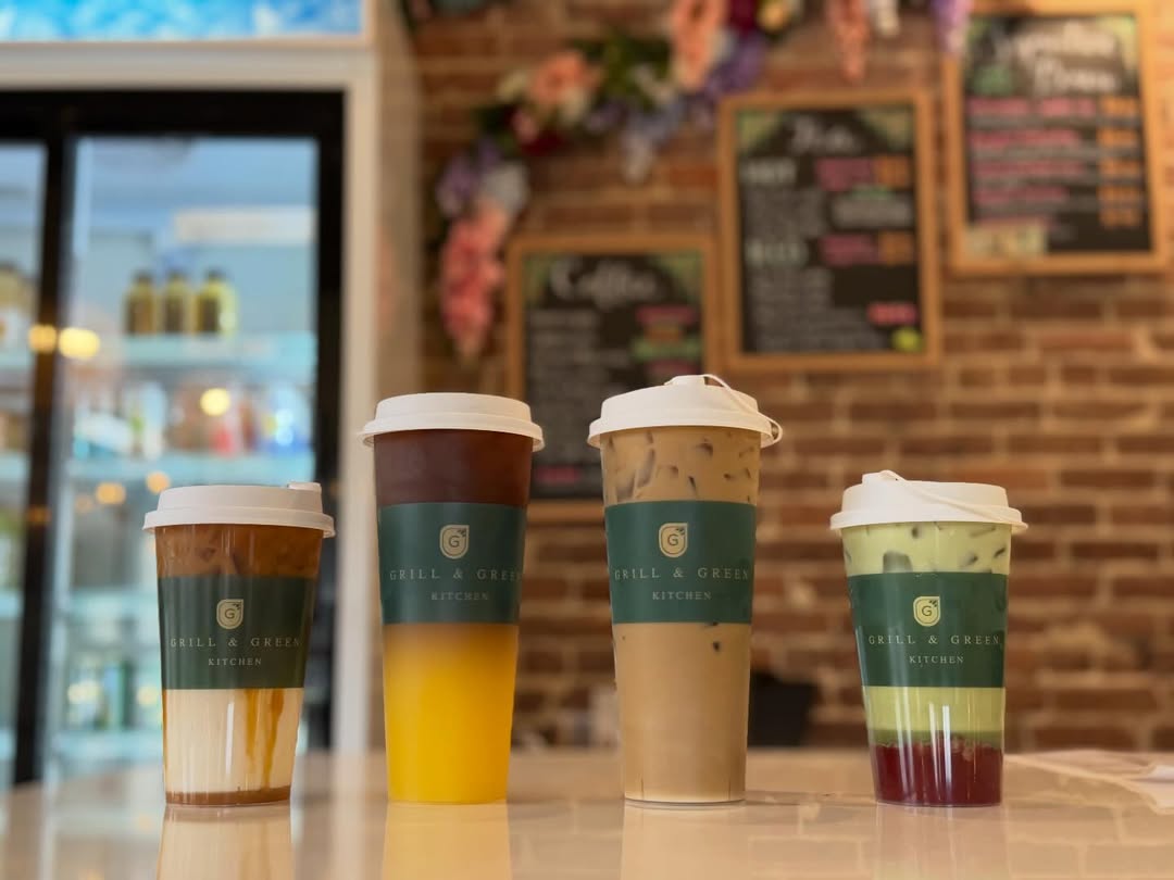Four signature iced drinks with branded sleeves